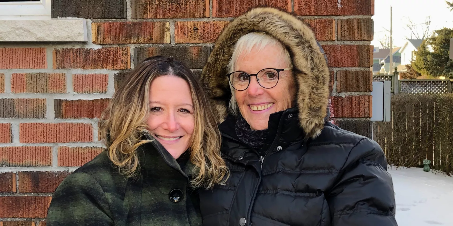 Rozi Trotter and Kelli Helpert two woman standing outside