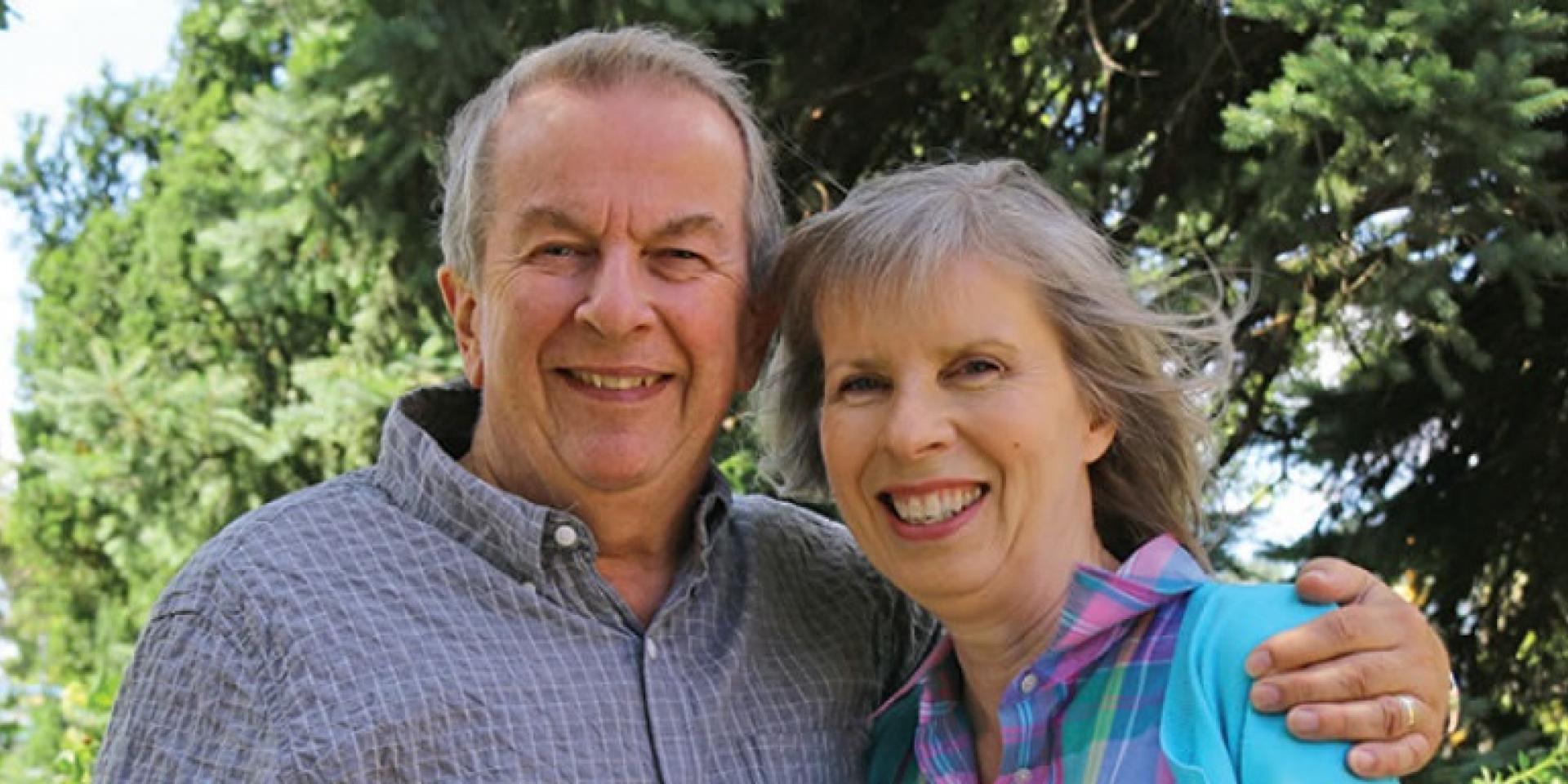 man and woman couple standing next to each other 