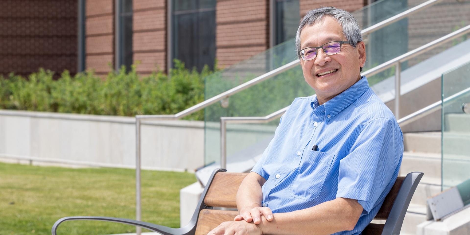 Photo of Dr. Leung smiling outside