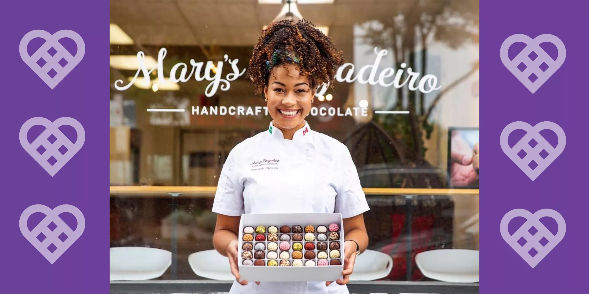 Mary Brigadeiro holding a box of chocolates in front of her chocolate store with a message saying "share the heart this valentine's day"