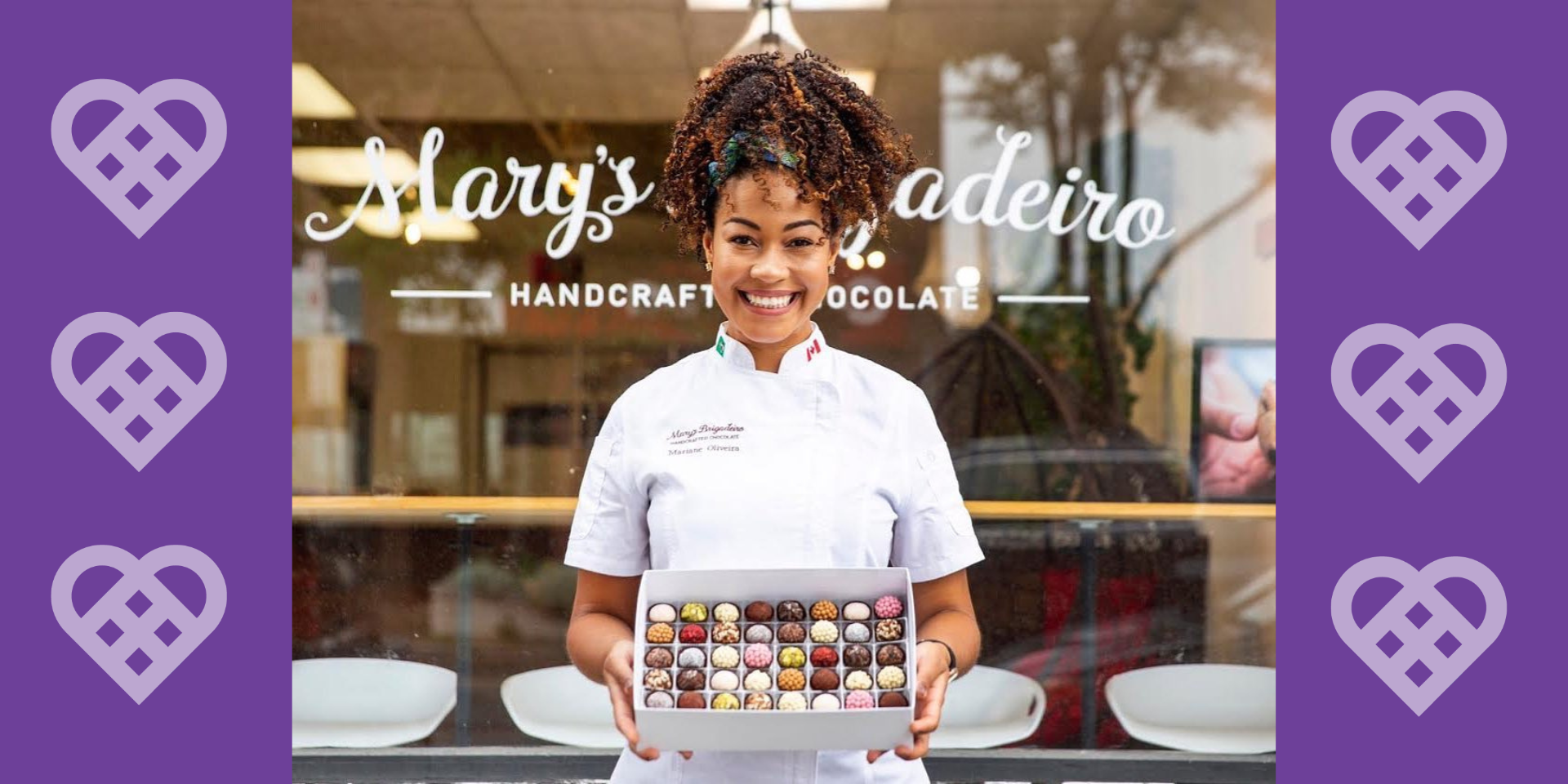 Mary Brigadeiro holding a box of chocolates in front of her chocolate store with a message saying "share the heart this valentine's day"
