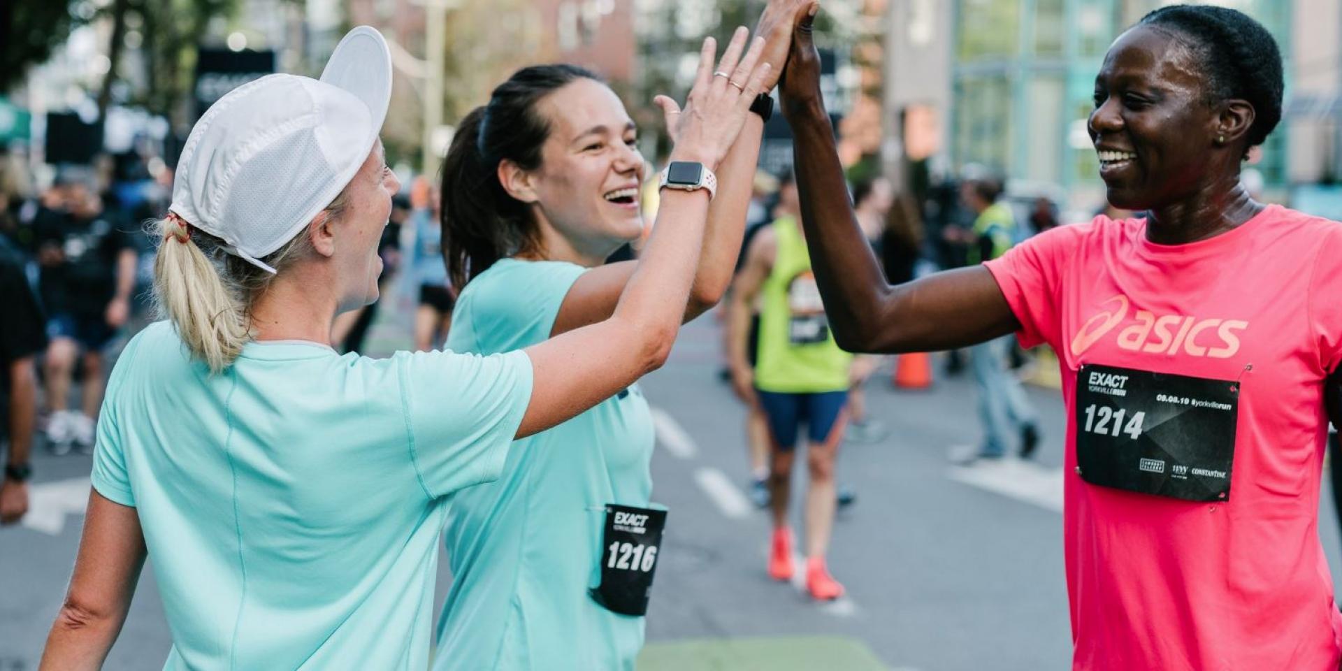 Runner celebrating a marathon at the finish line