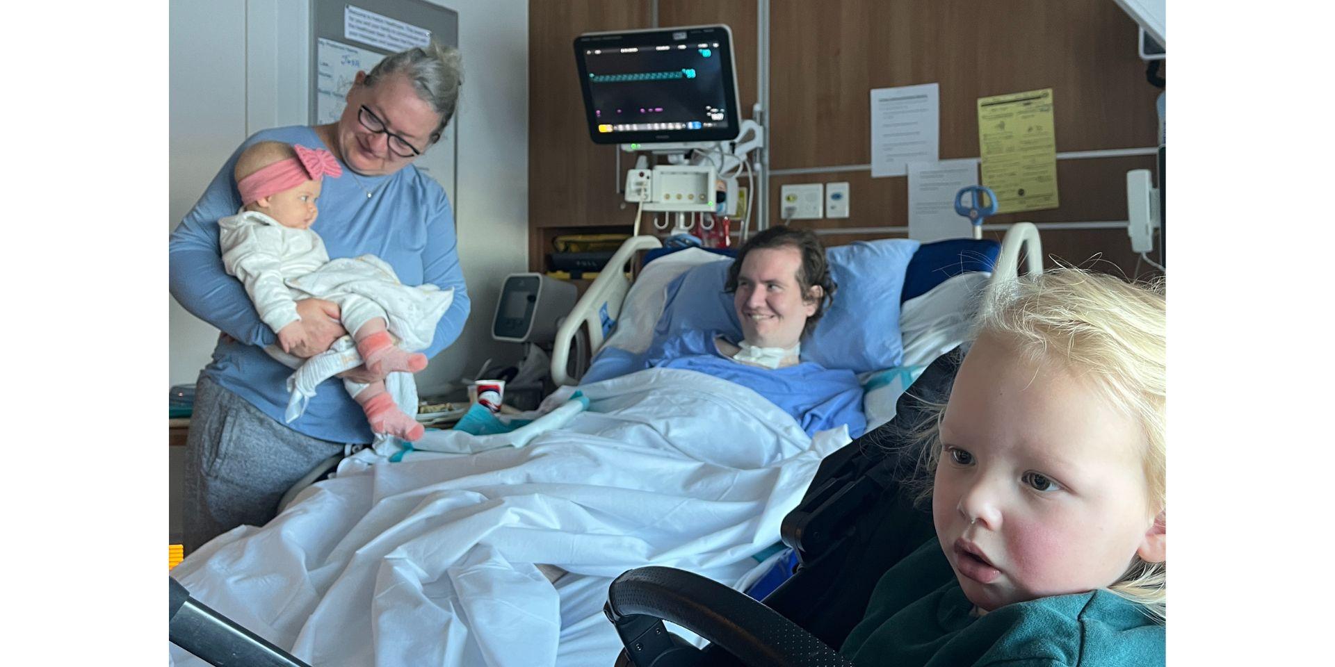 Josh Turner meets his niece and nephew, who were born while he was in intensive care. Colleen Petrick, Josh’s mom, is pictured on the left.