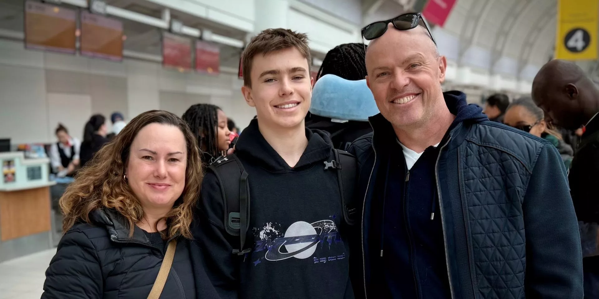 Chris Dulny with his son and wife in an airport