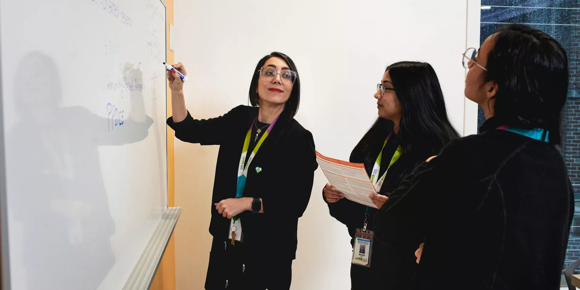 Sara Shearkhani, PhD, Evaluation & Equity Scientist with Michael Garron Hospital and East Toronto Health Partners, collaborates with her team.
