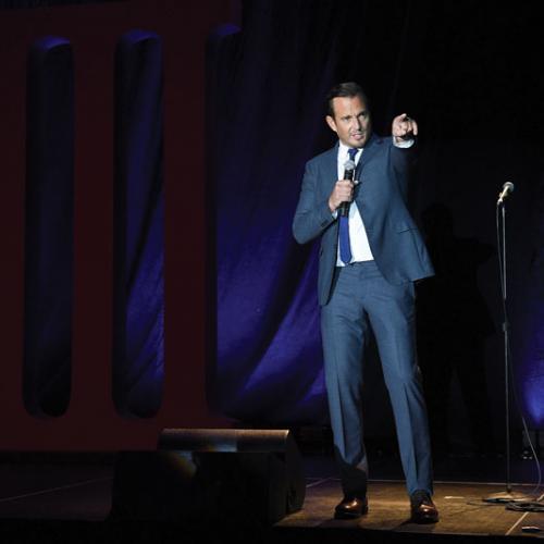 Will Arnett pointing at audience