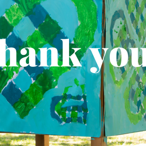Handmade signs with "thank you" overlay text