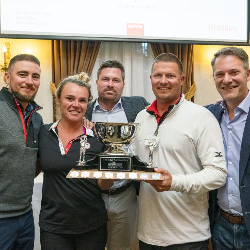 Winning foursome with trophy