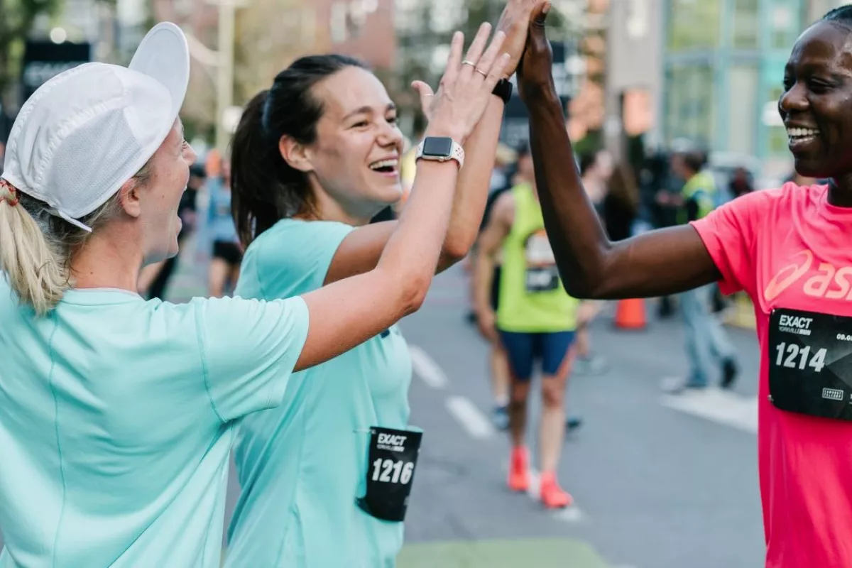 Runner celebrating a marathon at the finish line