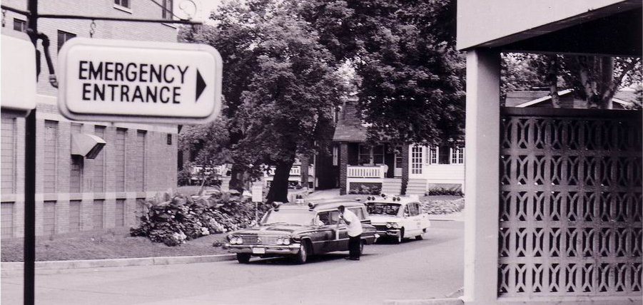 Historical sign directing people to the emergency department