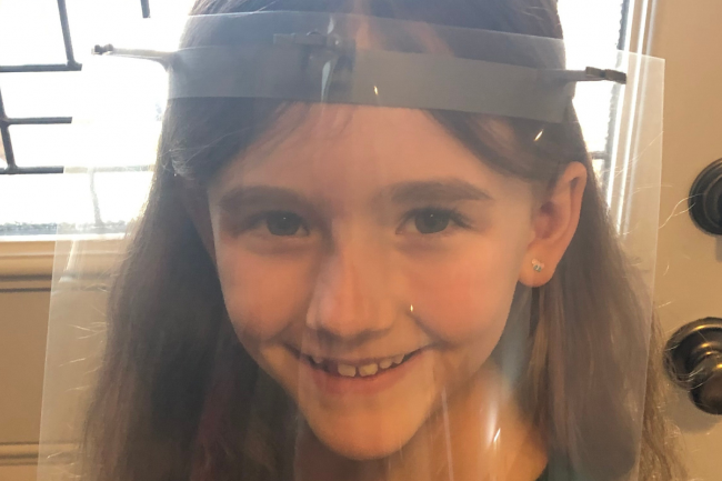 Andrew and Joanne’s daughter models a visor and shield made at home