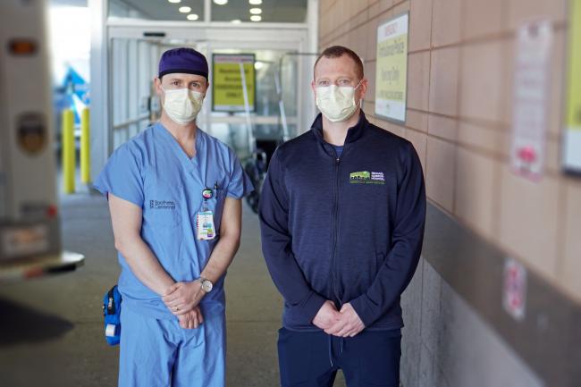 ED nurses with masks standing in hospital corridor