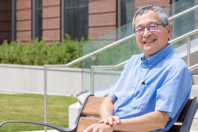 Photo of Dr. Leung smiling outside