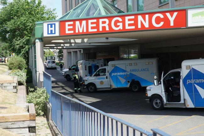 The exterior of the Stavro Emergency Bay with three ambulances lined up at Michael Garron Hospital