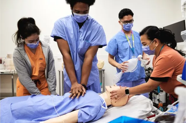 Practising a code blue scenario in the Rands Family Simulation Centre: Emma Kelly, RPN; Alexander Smith, RPN; Yuri Suico, Clinical Resource Lead, ED; and Sandra Millares, RN