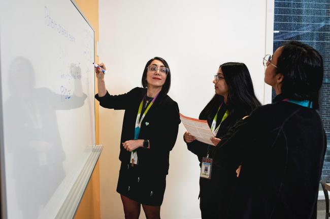 Sara Shearkhani, PhD, Evaluation & Equity Scientist with Michael Garron Hospital and East Toronto Health Partners, collaborates with her team.