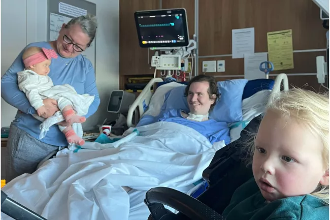 Josh Turner meets his niece and nephew, who were born while he was in intensive care. Colleen Petrick, Josh’s mom, is pictured on the left.
