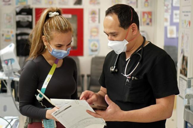 Dr. Kyle Vojdani, Chief and Medical Director of the Stavro Emergency Department, consults with Jessica Lo Russo, RPN.