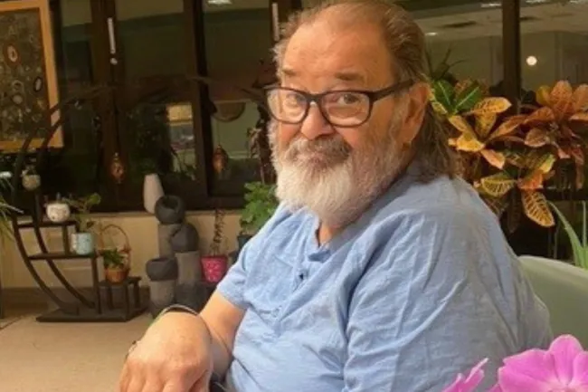 Bob, a midde aged man, sitting in one of MGH's patient rooms