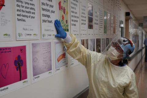 Ruby Quiambao, a Registered Nurse at Michael Garron Hospital, reads notes in our Gratitude Gallery.
