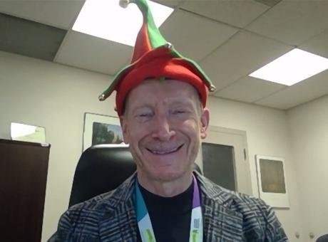 man wearing holiday hat 