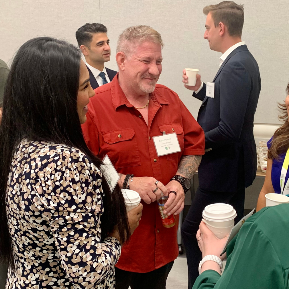 Professional Advisor breakfast guests chatting over coffee